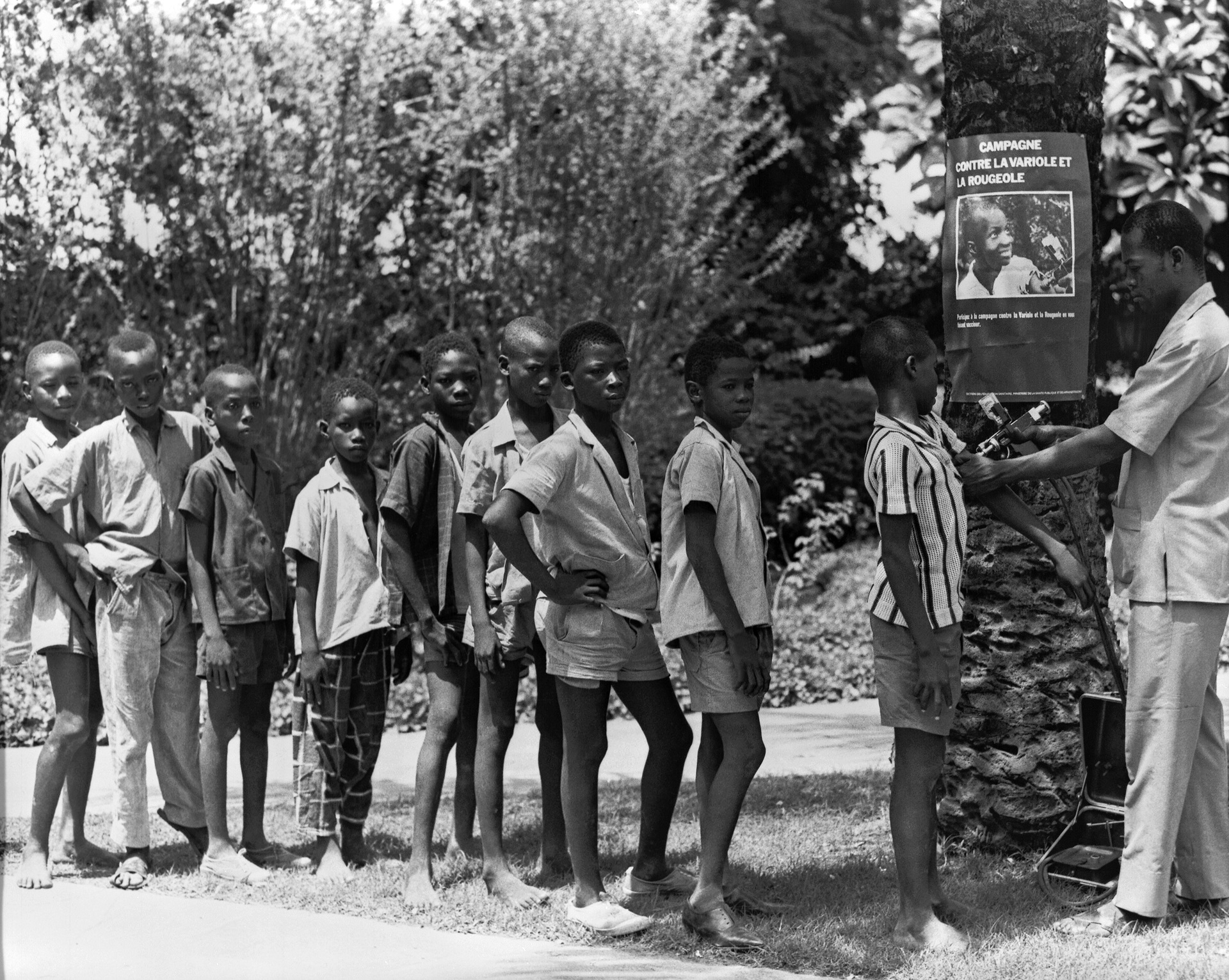Measles vaccination-West Africa-1968 Boys standing in line awaiting smallpox and measles vaccinations
