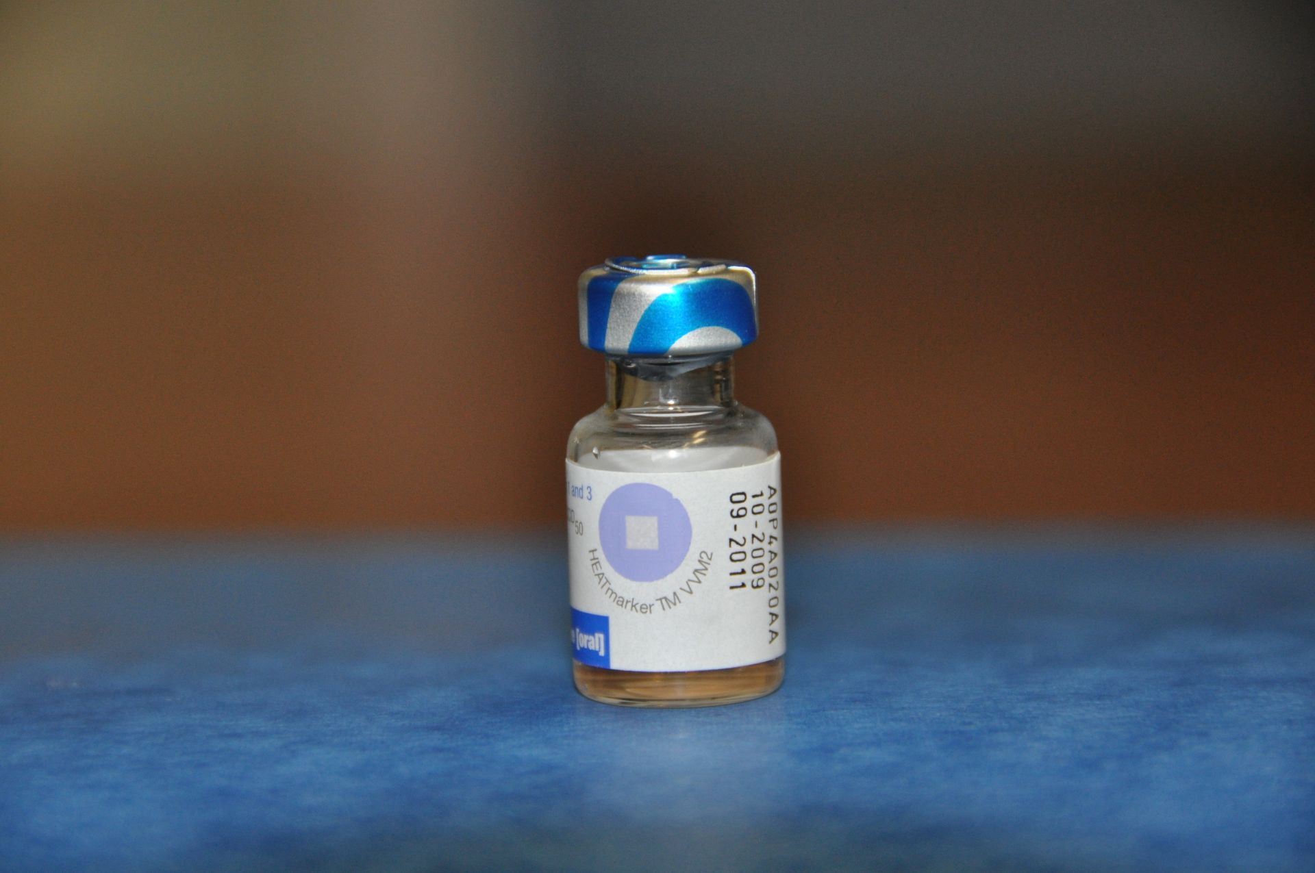 A vaccine vial monitor on a bivalent oral polio vaccine vial.