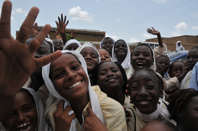 A group of joyful children in Sudan (2013) during an MDA