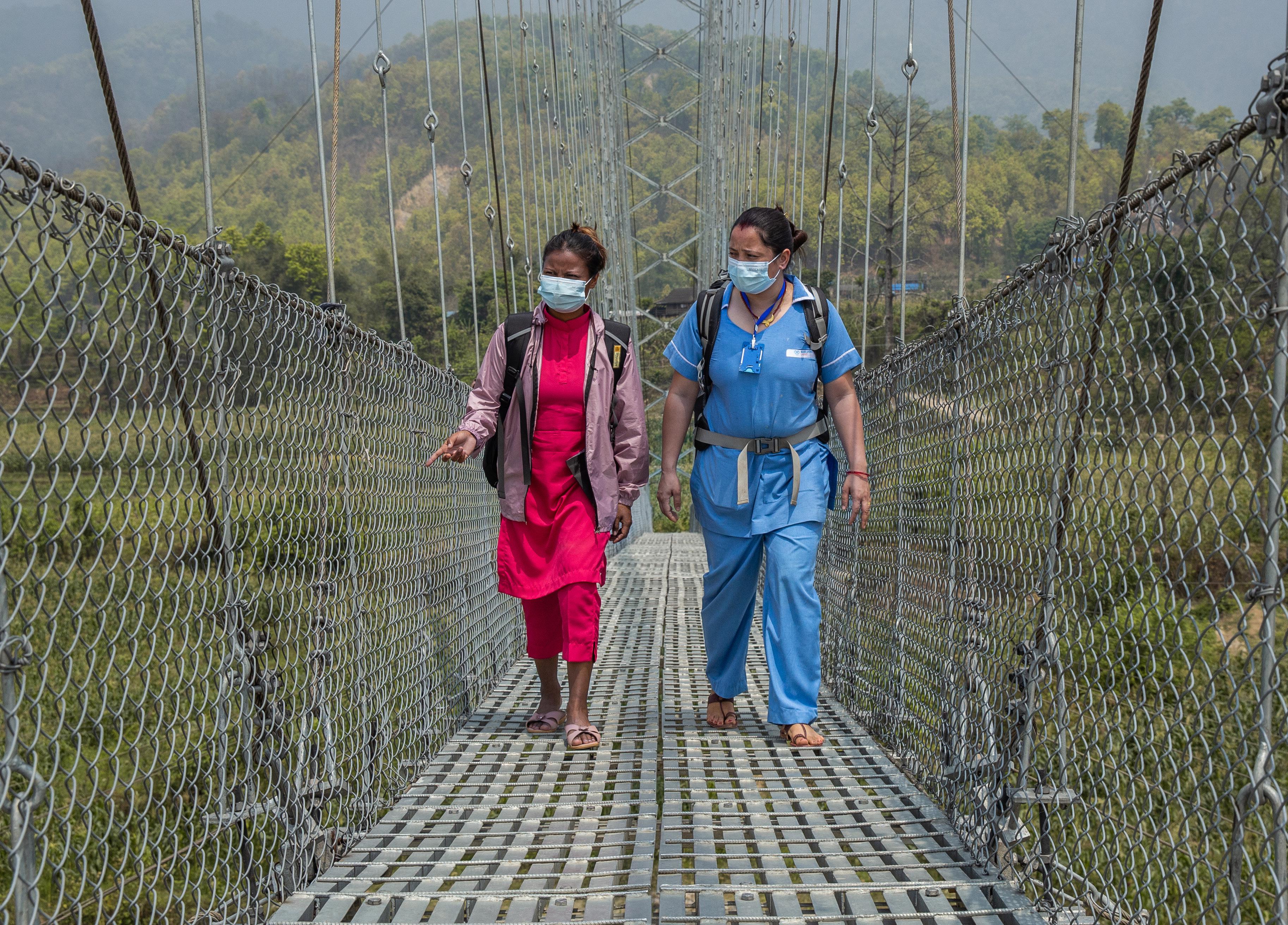 Kopisha, youth mobilizer, (left) and Chimini, a nurse midwife (right), cover huge distances, often on foot, committed to providing sexual and reproductive health services in rural areas.