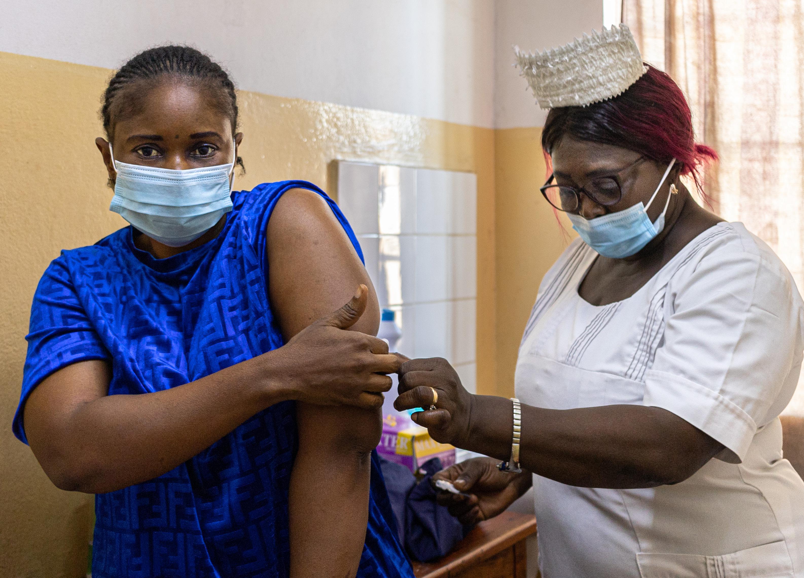 A nurse administers a contraceptive injection for a client at the Princess Christian Maternity hospital in Freetown, Sierra Leone.