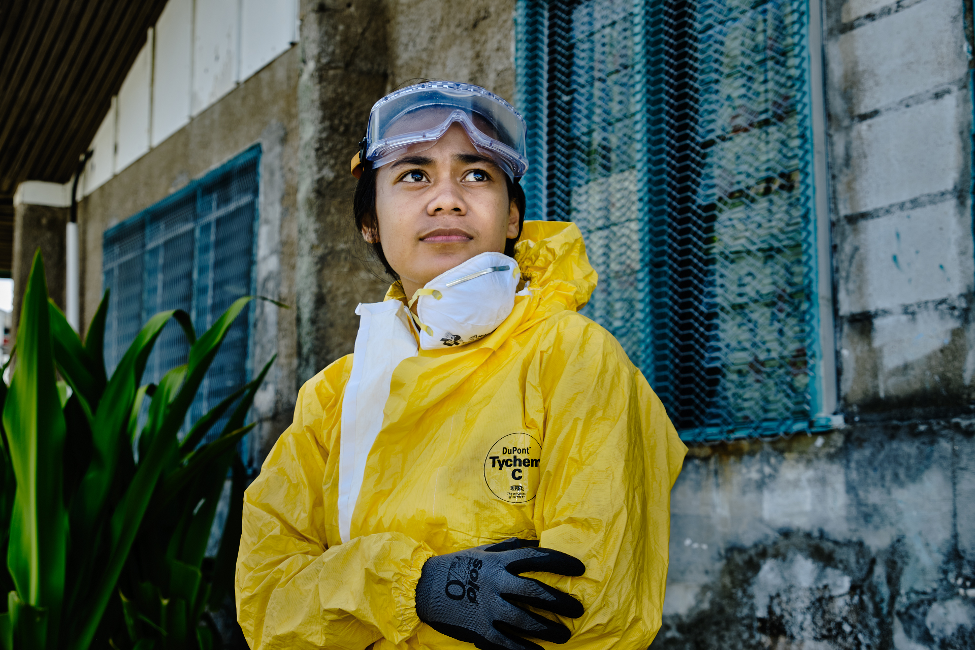 A community health officer spraying insecticide for mosquitoes in Tuvalu