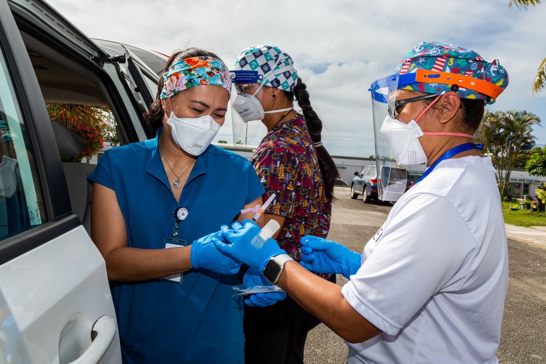 Healthcare workers in Guam preparing COVID-19 vaccines